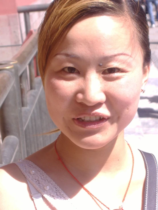 a woman standing in front of a railing