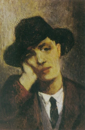 a man wearing a hat, tie and jacket by a wall