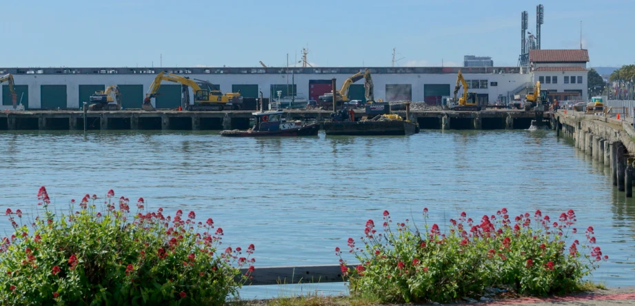 a pier with a large boat coming in to the dock