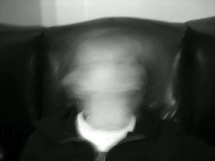 a blurry image of a man wearing a tie