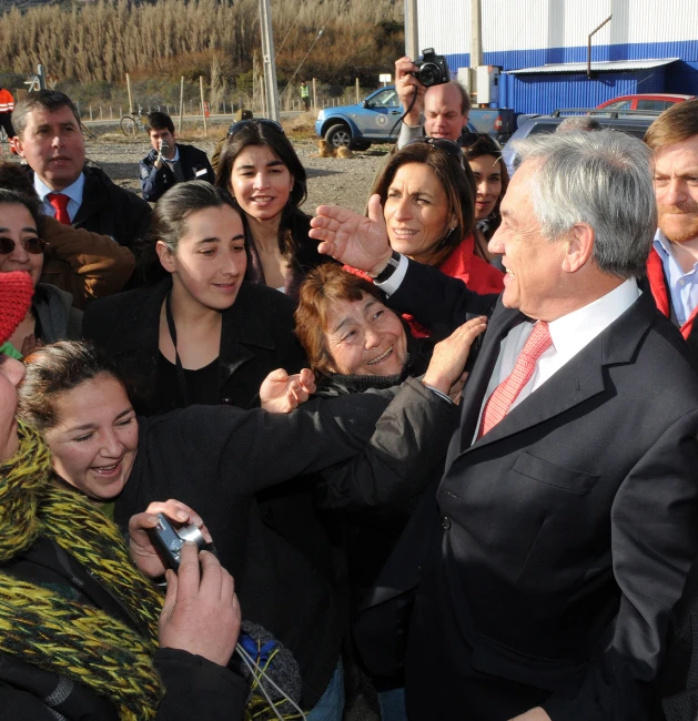 a group of people posing and clapping around