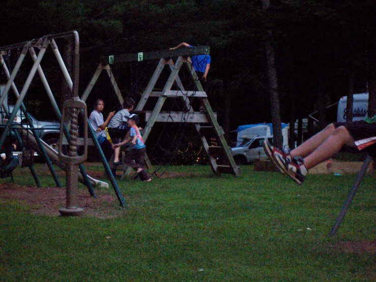 there are some people on wooden play sets