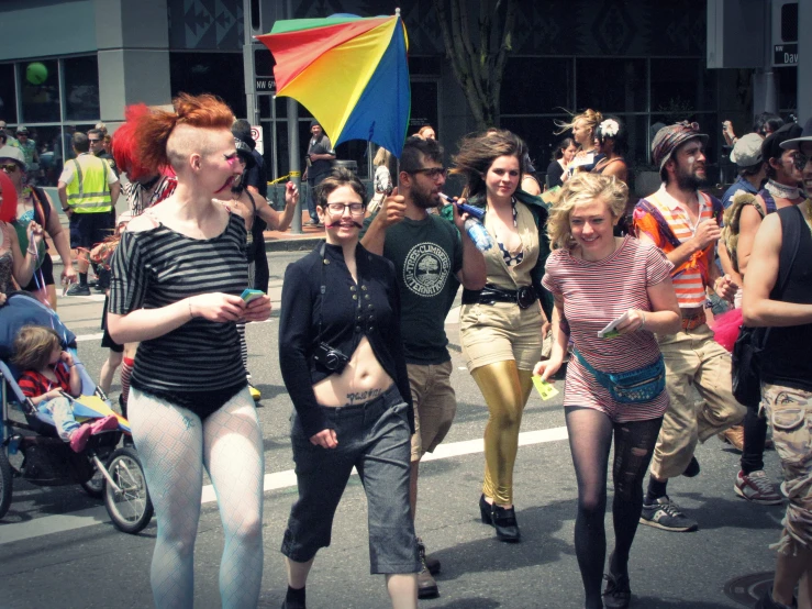 a group of people walking down a street