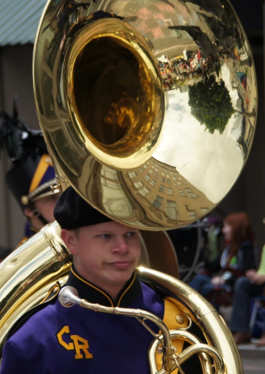 a young man is playing a ss instrument