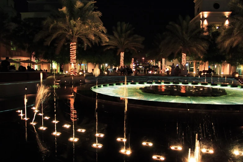 some large fountain and lights in the night