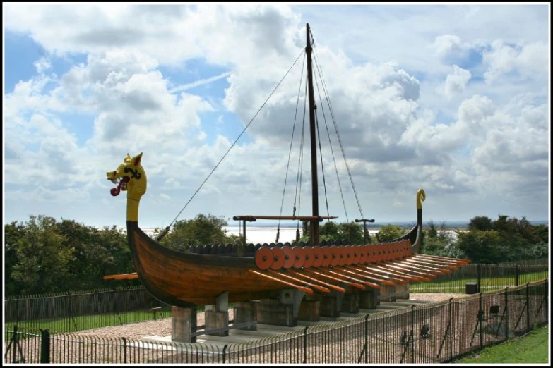 a replica of a boat on display in a park