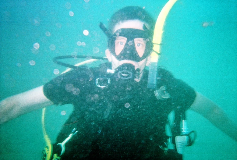 a scuba man with his gear up ready to go