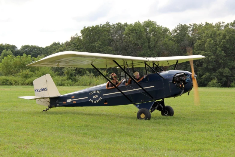 there is a small airplane parked in the grass