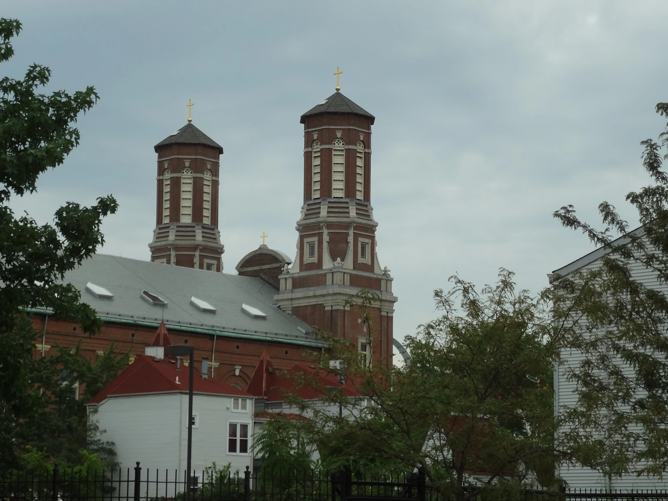 two buildings in front of the tops and sky