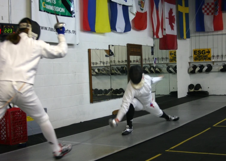 a man and a woman wearing white martial uniforms