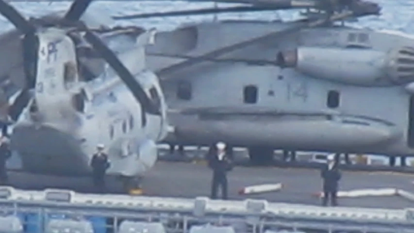 an image of a helicopter on the deck of the ocean