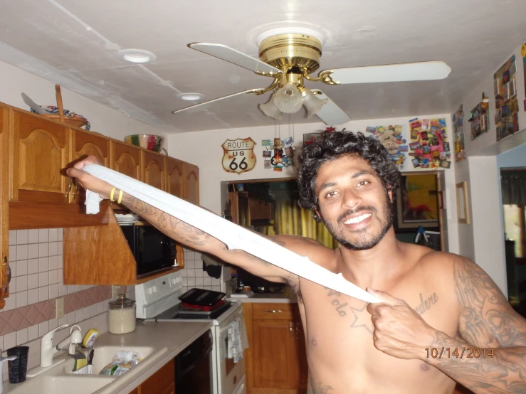 a man that is holding up a large knife