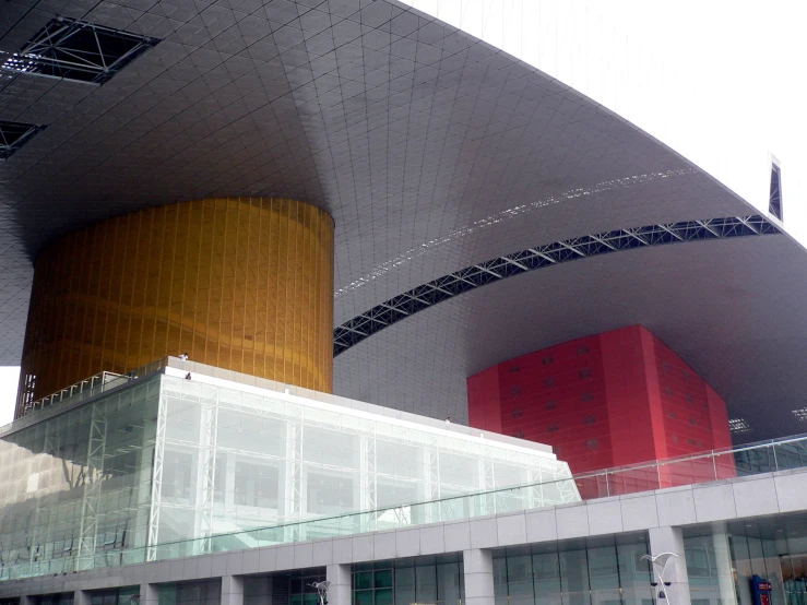 large red and yellow building with metal fence surrounding it