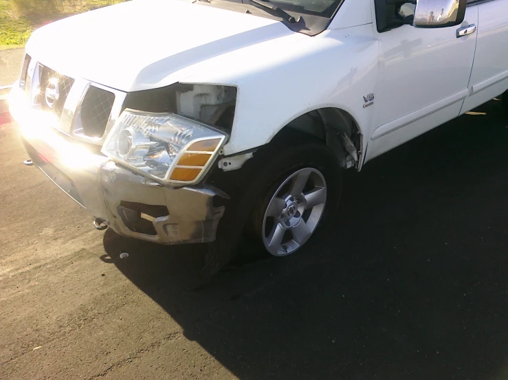 a white truck that has its hood open