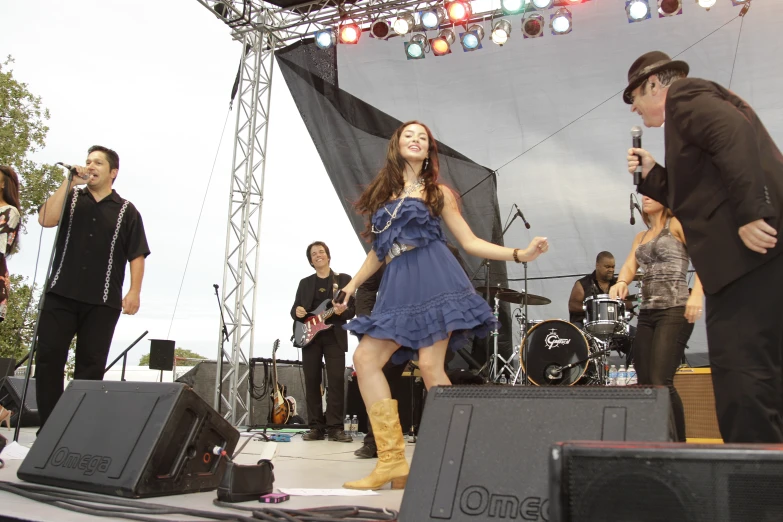 some people are standing in front of a microphone and guitars