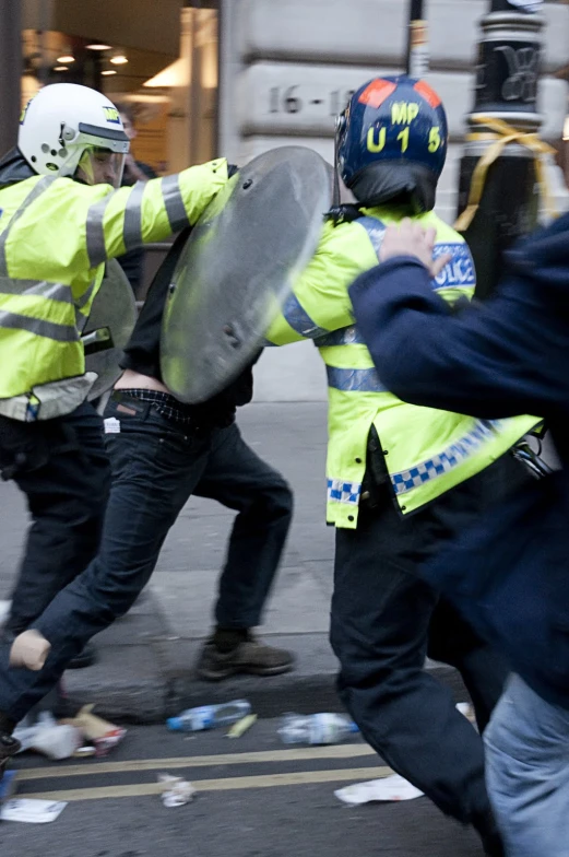 some police officers run away from the protesters