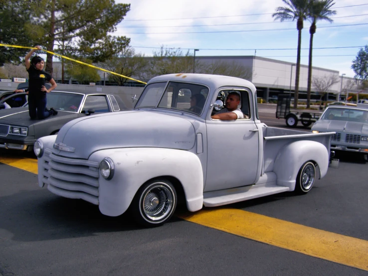 the old fashioned truck is painted in gray