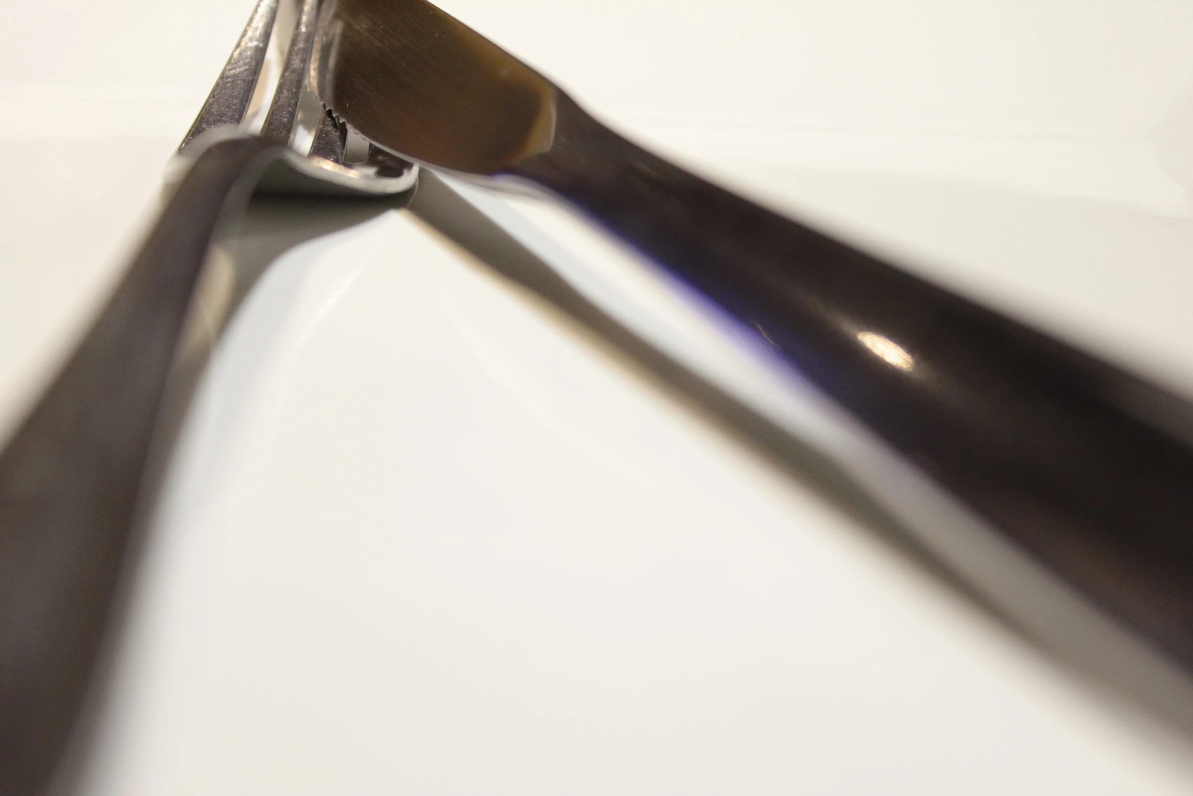 a closeup po of some scissors with a long handle