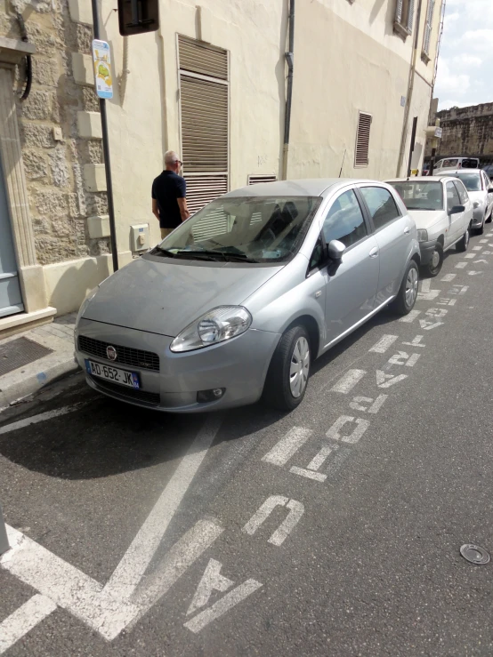 the car is on the street where several cars parked