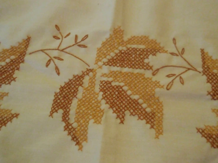 a picture of a embroidered curtain made up with floral stitching