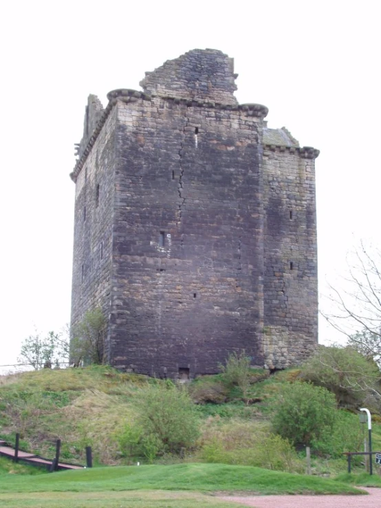 a very tall tower with some stairs going up it's side