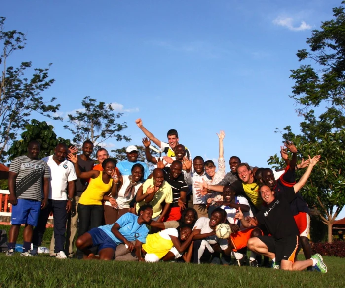 a group of people stand and pose for a po