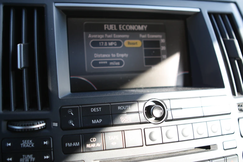 the dashboard of a car with a panel that displays the fuel economy