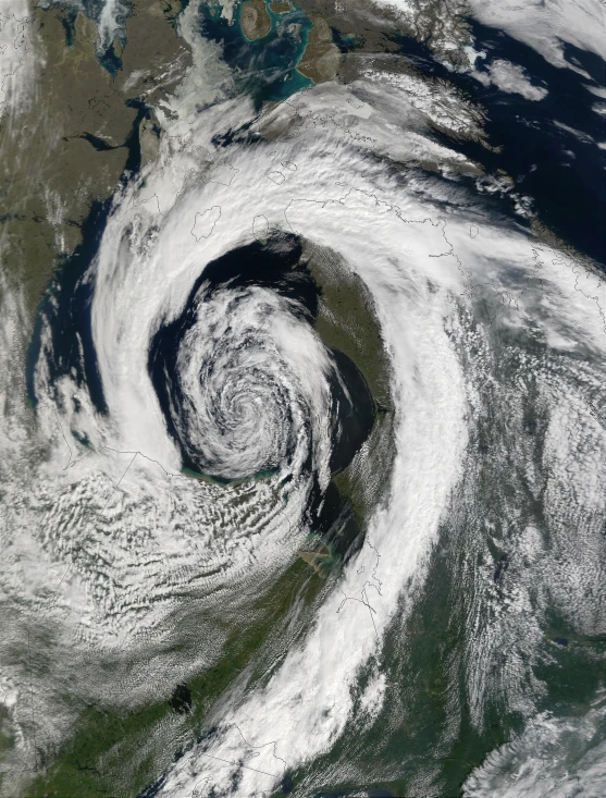 two white clouds over earth, with an area in the center and one in black