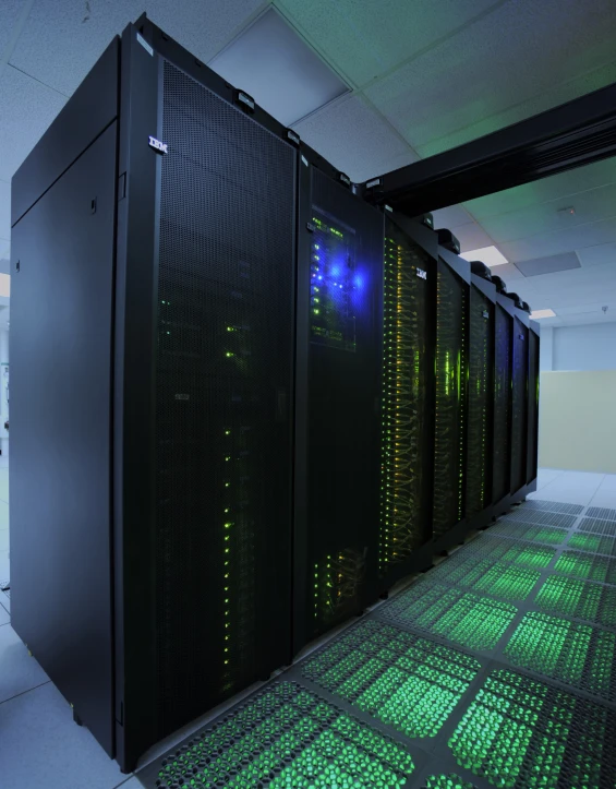 a row of servers next to each other in a dark room