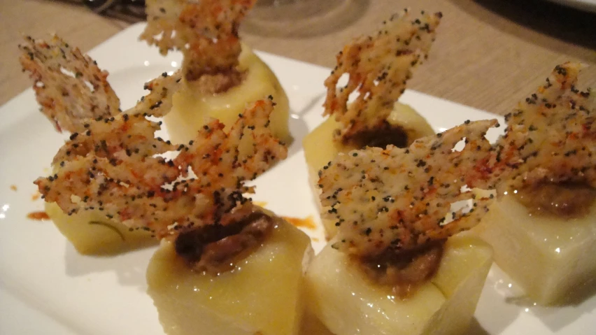 a plate with food, including some sort of appetizers