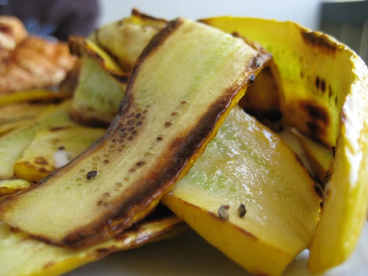 a plate with bananas and some other type of food