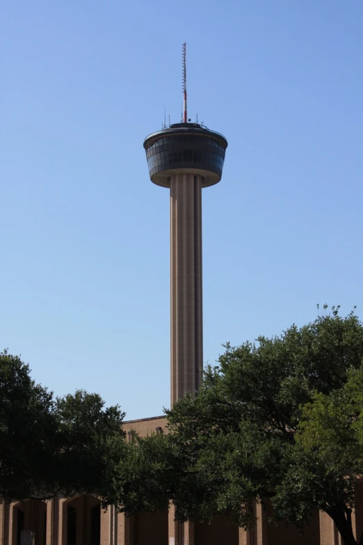 a tower that is in the middle of some trees