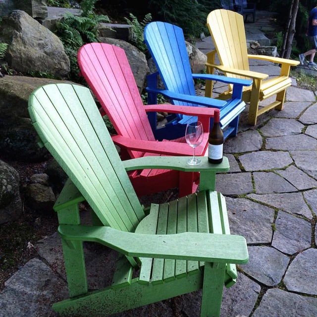 four brightly colored adi - chairs sitting in a row