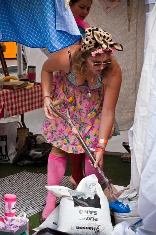 a woman with a funny bow around her head and dress