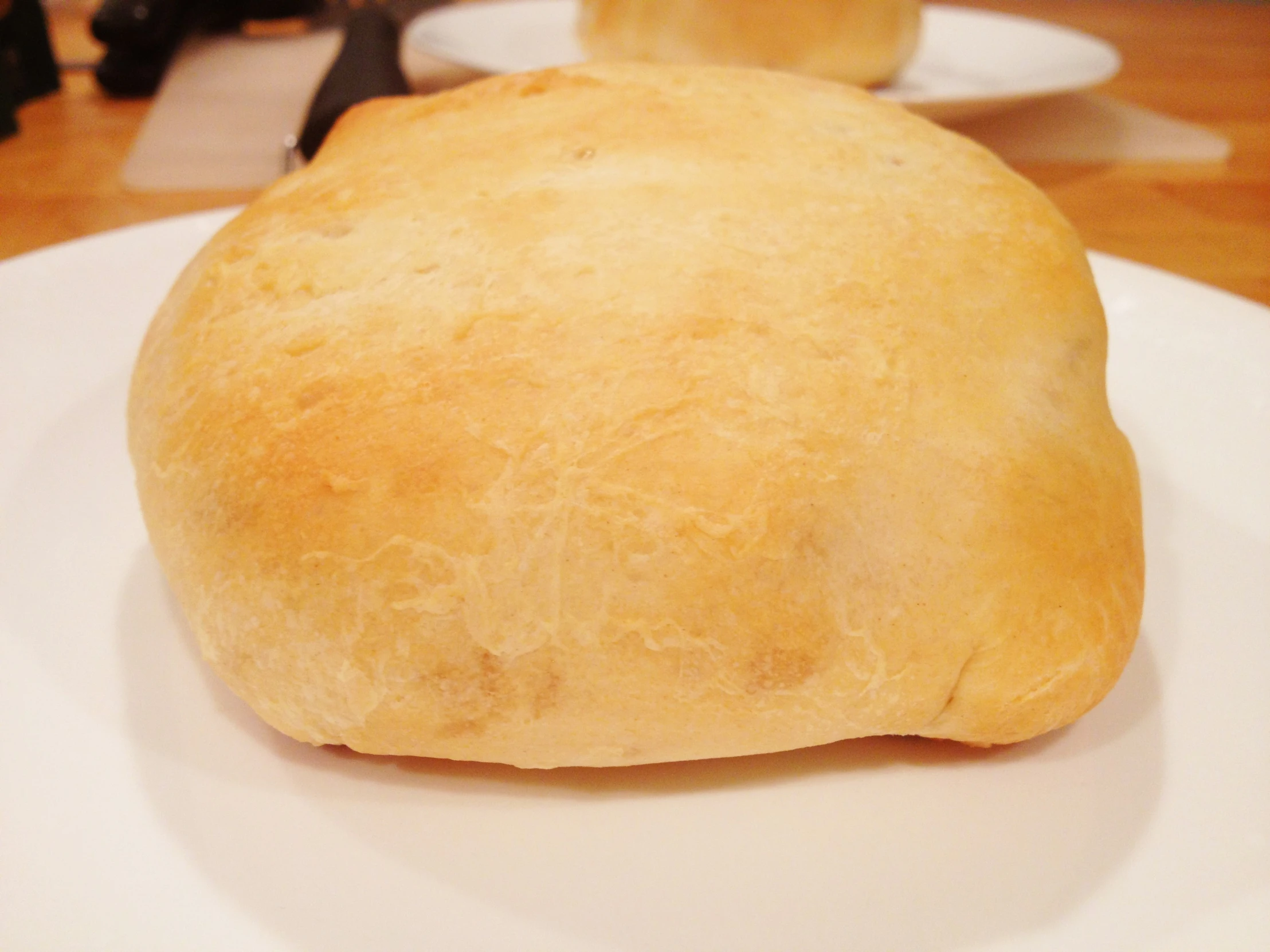 a small round white pastry on a plate