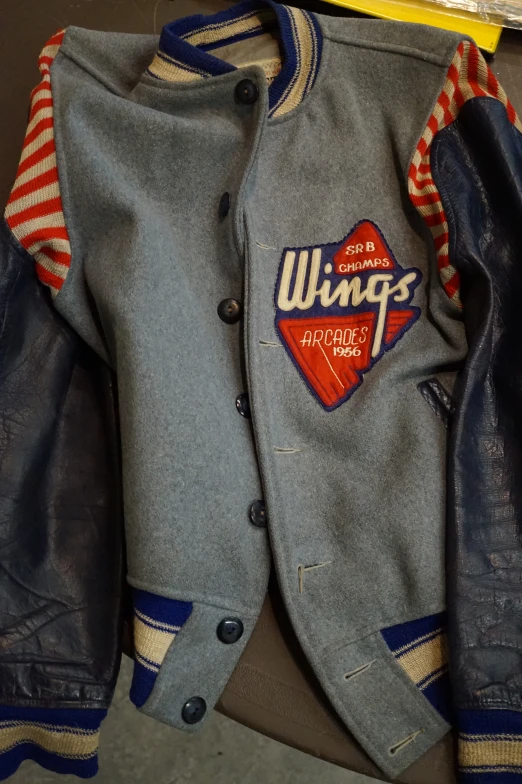 worn jacket with wing's patch and collar