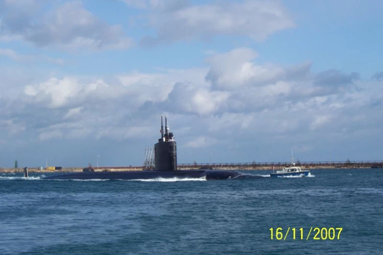 a large black submarine sailing in the ocean