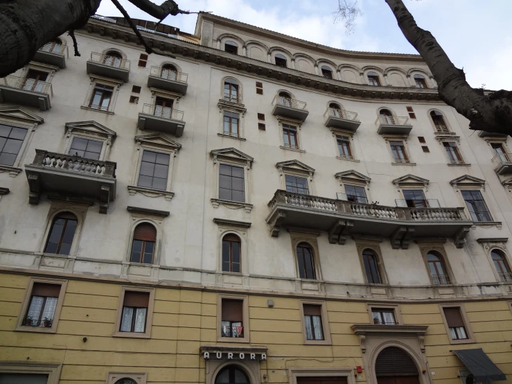 an old building has many balconies and windows