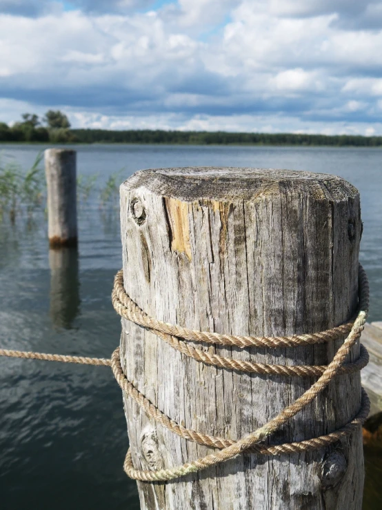 a knot hangs from the end of a pier