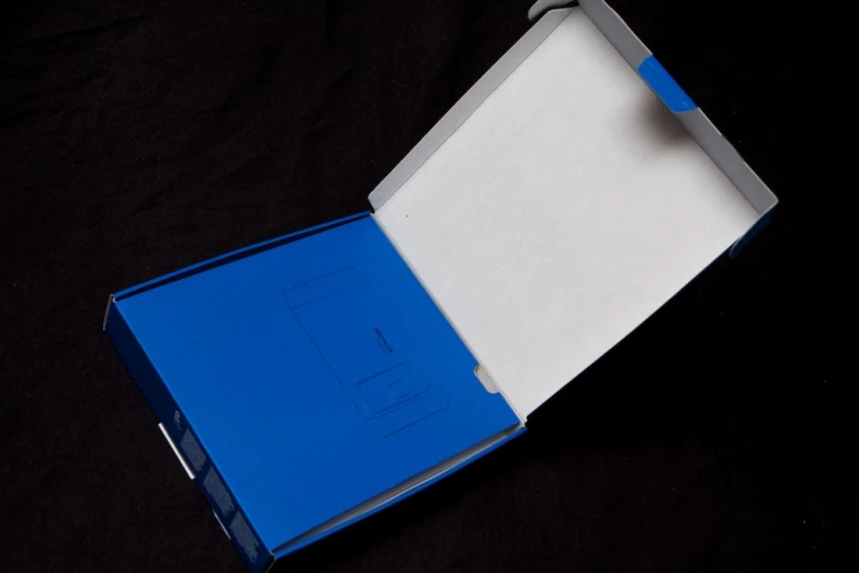 a blue box with an extra paper in it