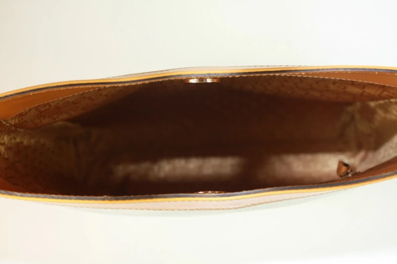 a brown and yellow flat shoe on white background