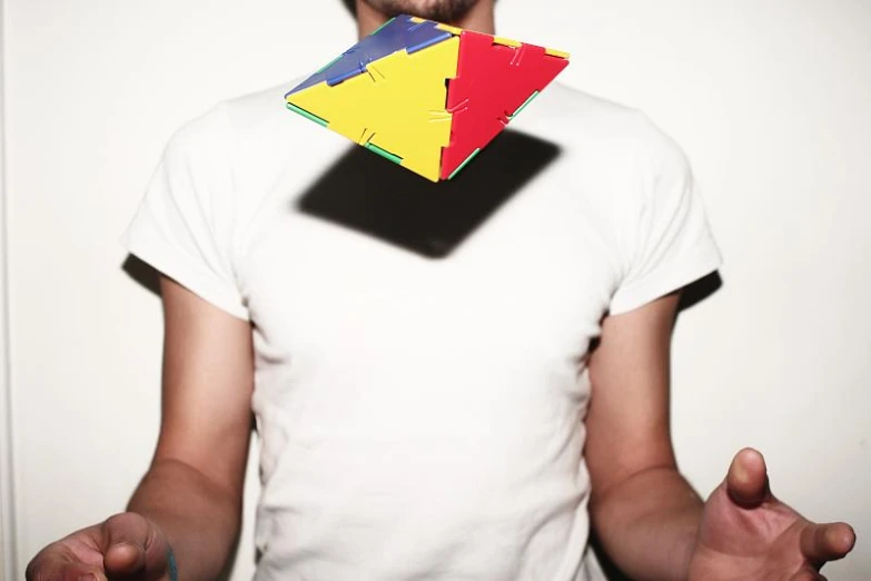 a man with a large square and two triangle shaped objects on his face