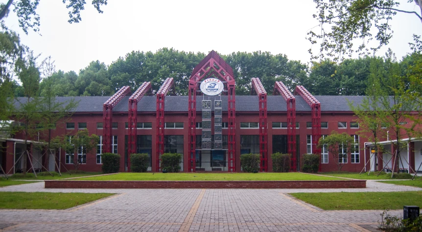 a red building with a white clock on the front