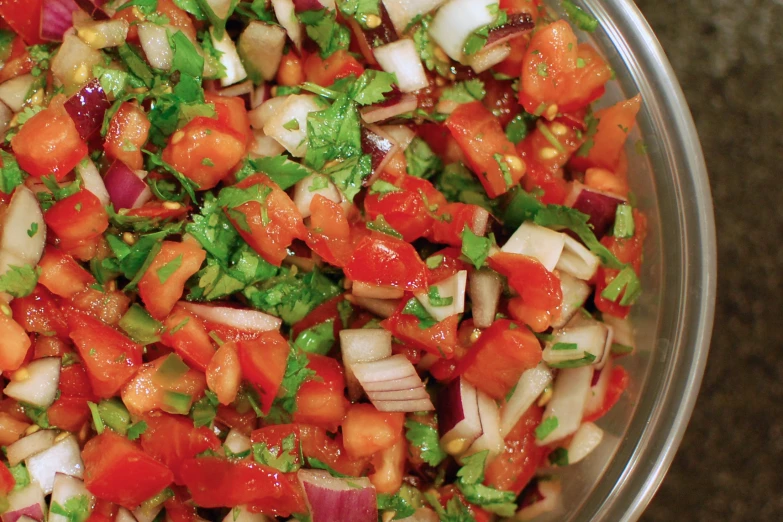 a bowl of chopped up vegetables sitting on a counter