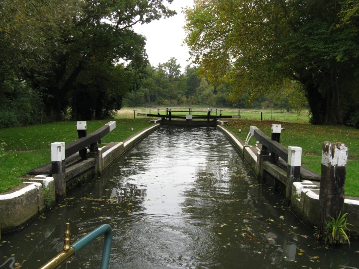 a couple of gates that are by some water