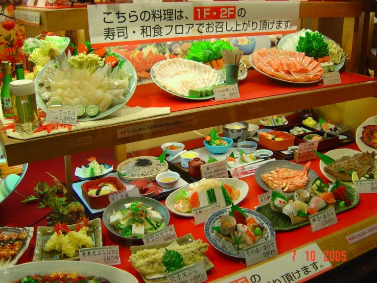 a close up of a number of plates of food on a table