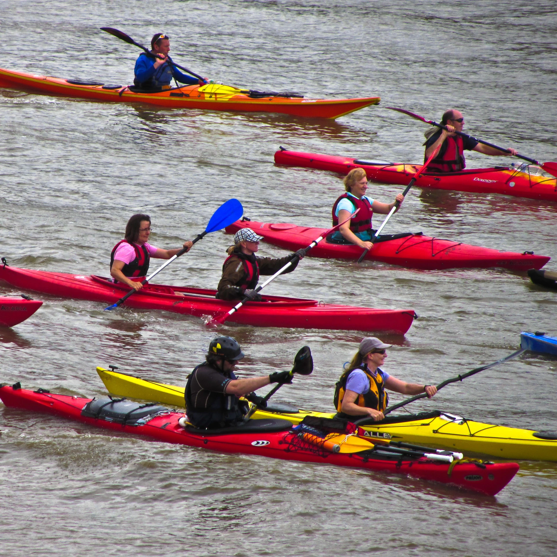 some people on kayaks are out in the water