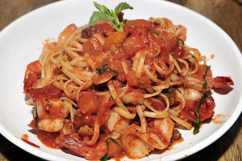 a plate with pasta and sauce on it