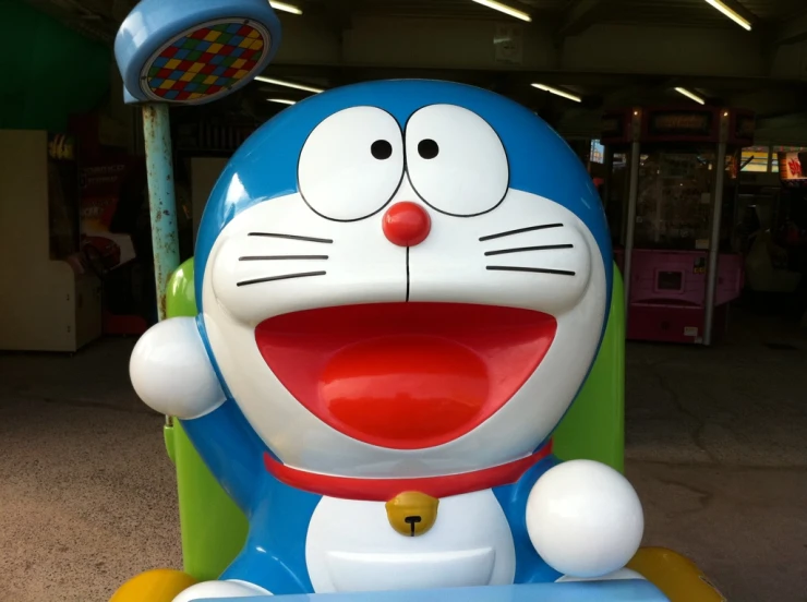 cartoon character at amut park with large sign in background