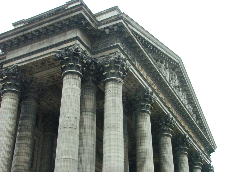 large stone structure with columns, all in different styles